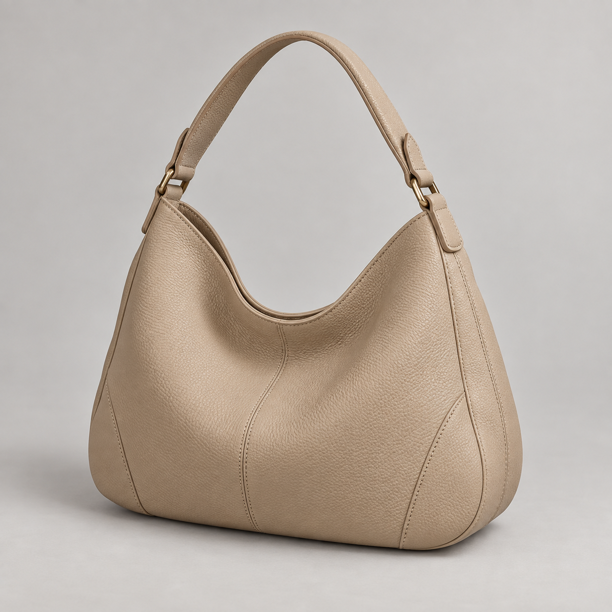 Sand Hobo: Slouchy hobo silhouette with a broad curved handle and understated stitching. Illustrative design reference.